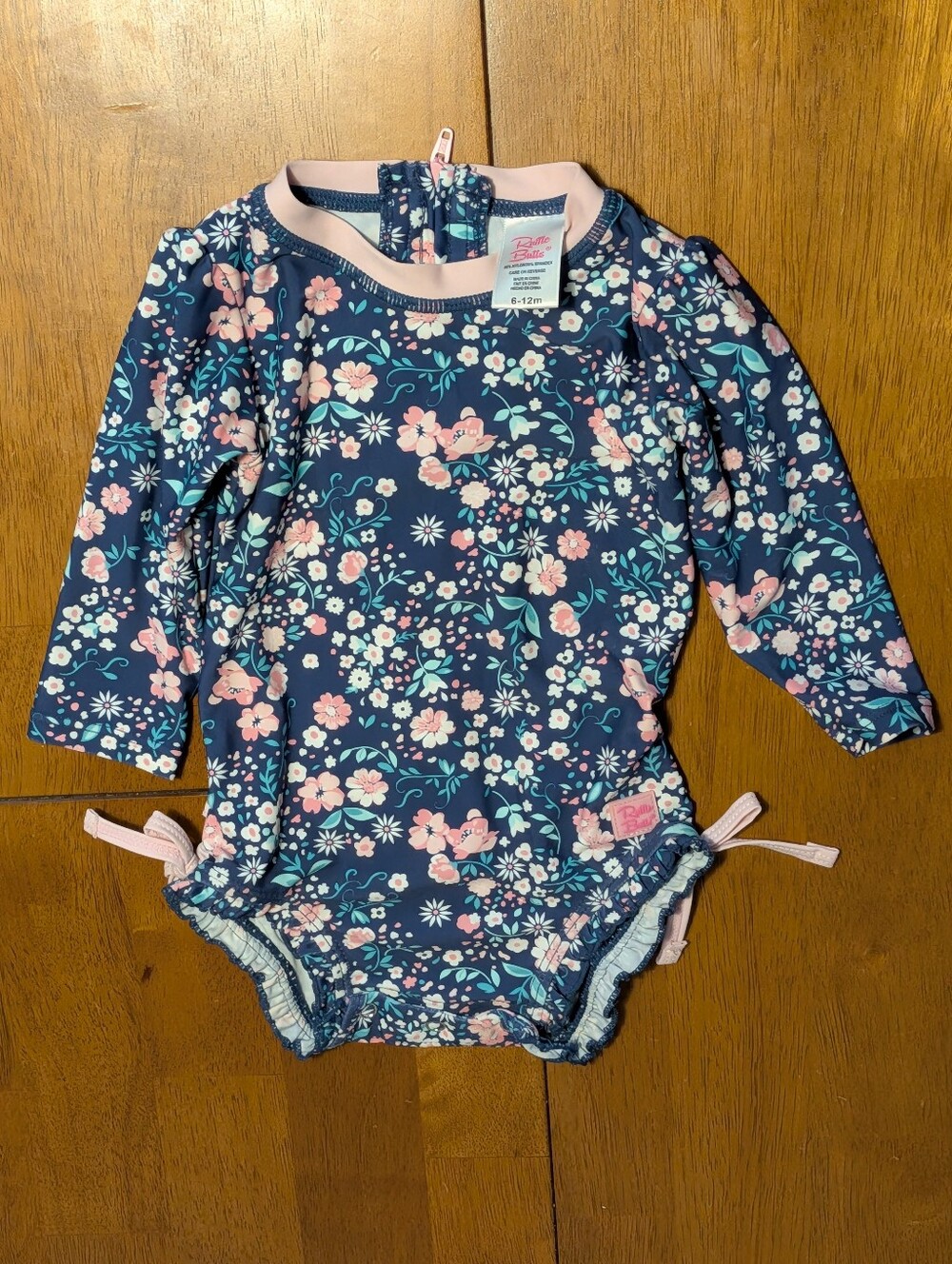 Ruffle Butts Navy Floral Long-Sleeve Swim Suit with Pink Trim